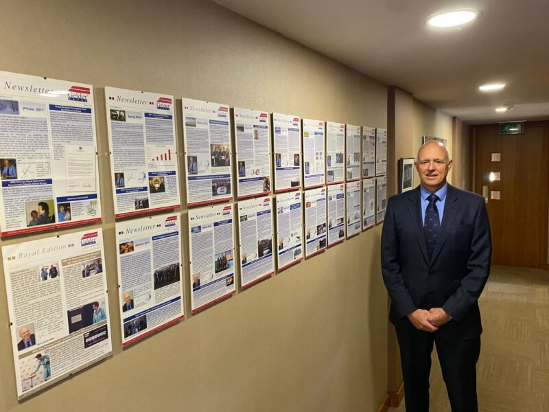 CEO Steve Gelder with collection of published newsletters.