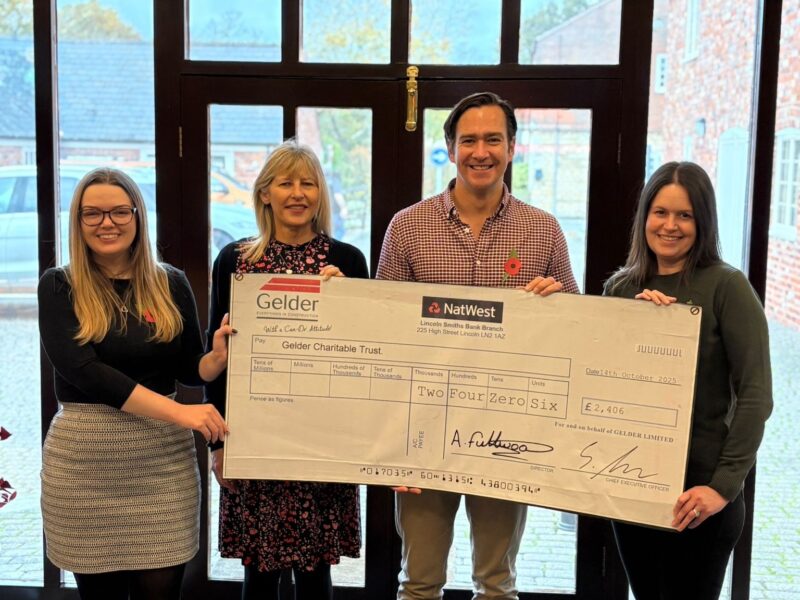 Jason handing over the cheque to the Gelder Charitable Trust